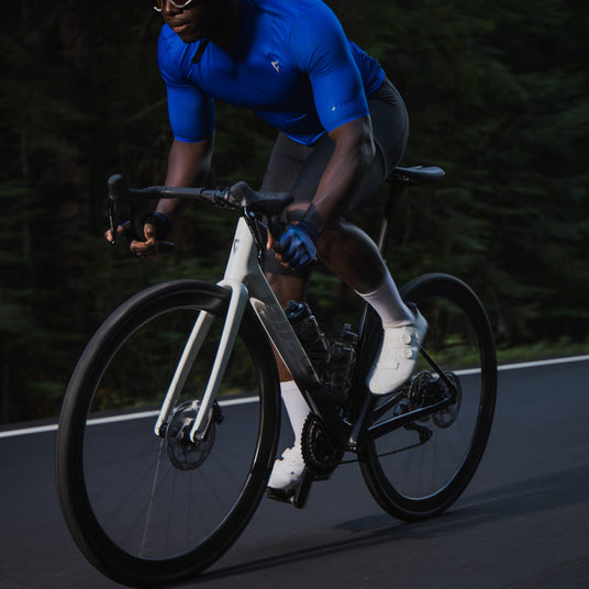 Giant Defy Advanced Pro 1 rider standing up and sprinting