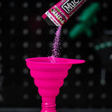 Muc-Off pink Collapsible Silicone Funnel used for refilling cleaning powder