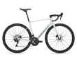 A white Giant road bicycle with black components, including the wheels, saddle, handlebars, and drivetrain, shown from a side profile on a white background.