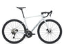 A white Giant road bicycle with black components, including the wheels, saddle, handlebars, and drivetrain, shown from a side profile on a white background.