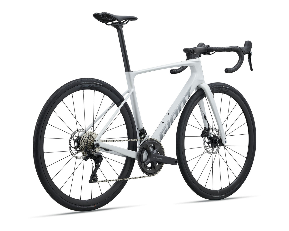 A white and black Giant road bicycle with drop handlebars, disc brakes, and a sleek carbon fiber frame, shown on a clean white background.
