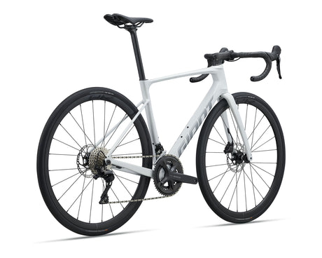 A white and black Giant road bicycle with drop handlebars, disc brakes, and a sleek carbon fiber frame, shown on a clean white background.