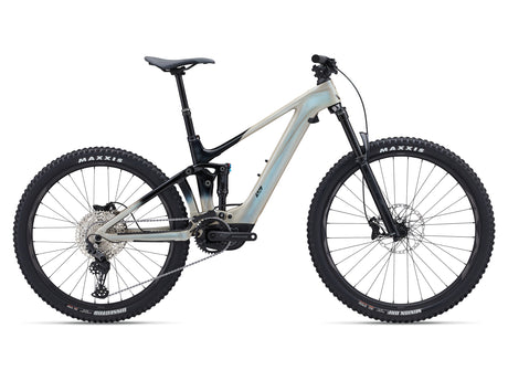 A Liv Intrigue X Advanced E+ EL 3 electric mountain bike with a light blue frame and black accents, featuring a front suspension fork, rear suspension, and a chain drive system.