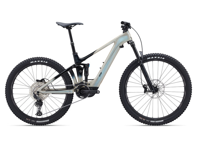 A Liv Intrigue X Advanced E+ EL 3 electric mountain bike with a light blue frame and black accents, featuring a front suspension fork, rear suspension, and a chain drive system.