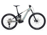 A Liv Intrigue X Advanced E+ EL 3 electric mountain bike with a light blue frame and black accents, featuring a front suspension fork, rear suspension, and a chain drive system.