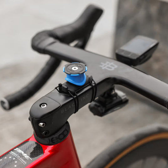 Quad Lock Stem Mount phone holder being used on a road bike stem.