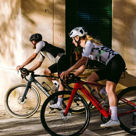 Two riders on new Cannondale Synapse endurance road bikes on a country road