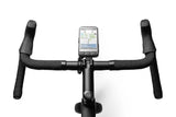 Wahoo ELEMNT ACE shown on road bike handlebars with the new out-front mount