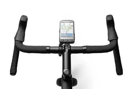 Wahoo ELEMNT ACE shown on road bike handlebars with the new out-front mount