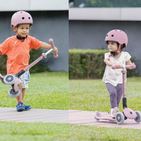 Toddler Scooters being ridden by girl and boy on a foot path.