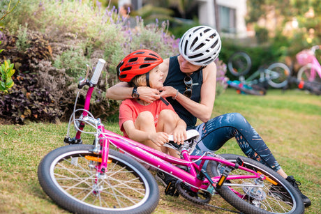 Parent fitting bike helmet to child