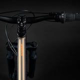 Norco Storm Youth 24 (2025) in Nanaimo Brown 24-inch kids mountain bike showing Storm logo and gear shifter