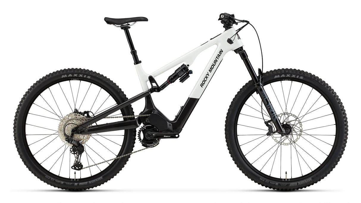 2026 Rocky Mountain Instinct Powerplay SL Carbon 50 carbon electric mountain bike, drive side, showing Dyname S4 Lite motor and idler pulley