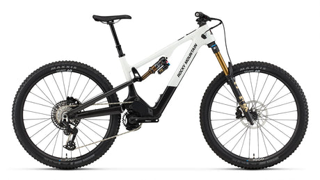 2026 Rocky Mountain Instinct Powerplay SL Carbon 70 carbon electric mountain bike, drive side, showing Dyname S4 Lite motor and idler pulley