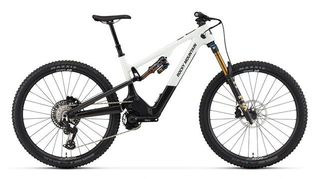 2026 Rocky Mountain Instinct Powerplay SL Carbon 70 carbon electric mountain bike, drive side, showing Dyname S4 Lite motor and idler pulley